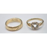 TWO 9CT GOLD RINGS INCLUDING ONE SET WITH DIAMONDS
