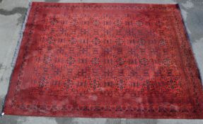 20TH CENTURY PERSIAN ISLAMIC RED GROUND RUG