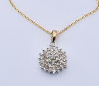 GOLD AND DIAMOND CLUSTER PENDANT NECKLACE