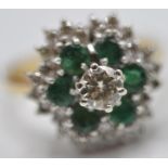 STAMPED 18CT GOLD RING WITH DIAMOND AND EMERALDS