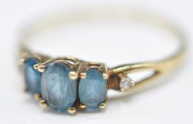 9CT GOLD BLUE STONE AND DIAMOND RING