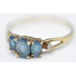 9CT GOLD BLUE STONE AND DIAMOND RING