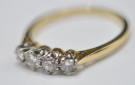 18CT GOLD AND FOUR DIAMOND RING