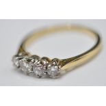 18CT GOLD AND FOUR DIAMOND RING