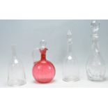 COLLECTION OF FOUR 19TH CENTURY AND LATER CUT GLASS DECANTERS