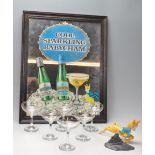 SET OF SIX RETRO BABYCHAM GLASSES AND AN ADVERTISING MIRROR.