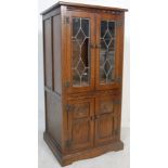 20TH CENTURY OLD CHARM WOOD BROS OAK PEDESTAL CABINET