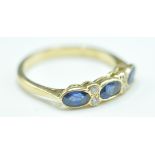 18CT GOLD SAPPHIRE & DIAMOND SEVEN STONE RING