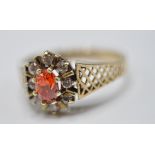 9CT GOLD ORANGE AND WHITE STONE RING