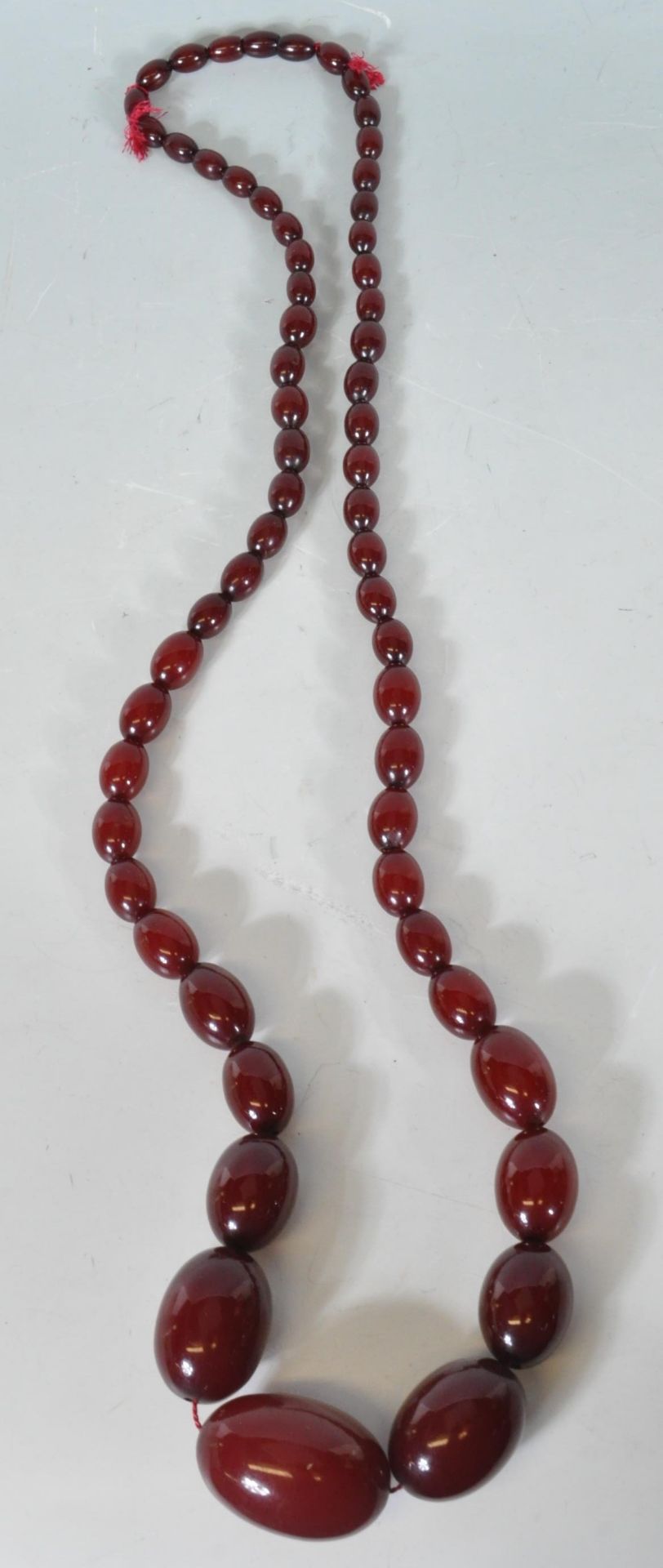 An early 20th Century cherry bakelite necklace con