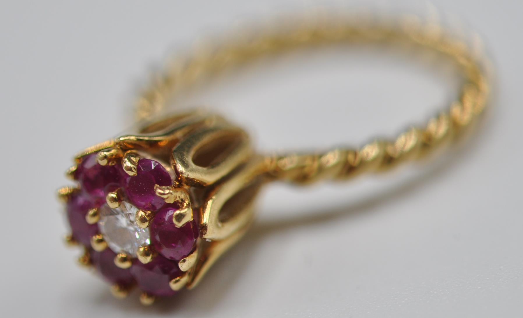 STAMPED 14CT GOLD RING WITH DIAMONDS AND RUBIES