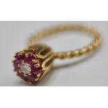 STAMPED 14CT GOLD RING WITH DIAMONDS AND RUBIES