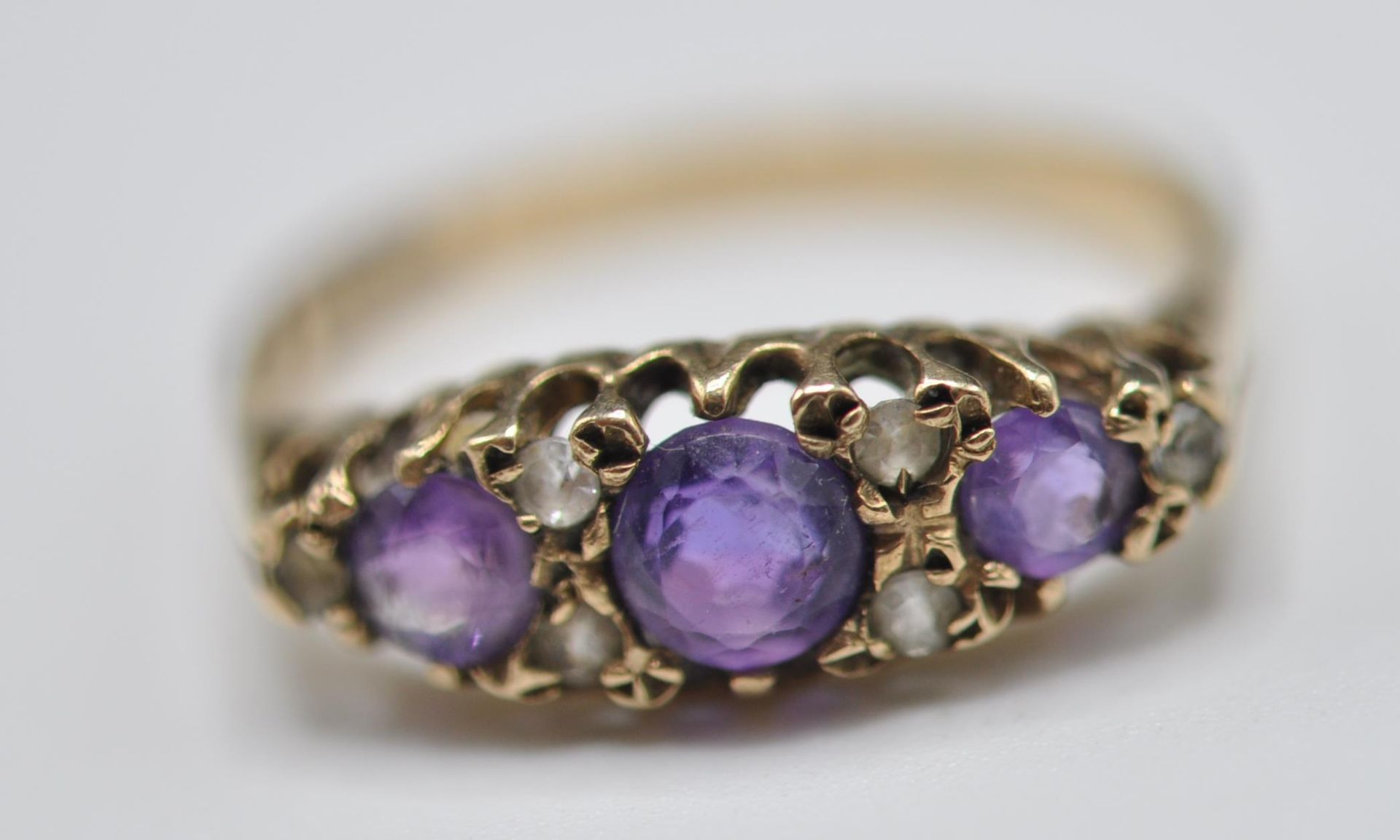 1920'S 9CT GOLD PURPLE AND WHITE STONE RING