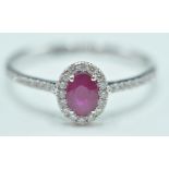 18CT WHITE GOLD LADIES DRESS RING WITH RUBY AND DI