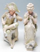 PAIR OF 20TH CENTURY BISQUE FIGURINES OF A COUPLE