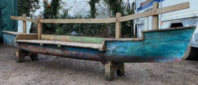 LARGE INDUSTRIAL EXTERIOR GARDEN BENCH FORMED FROM A CANOE