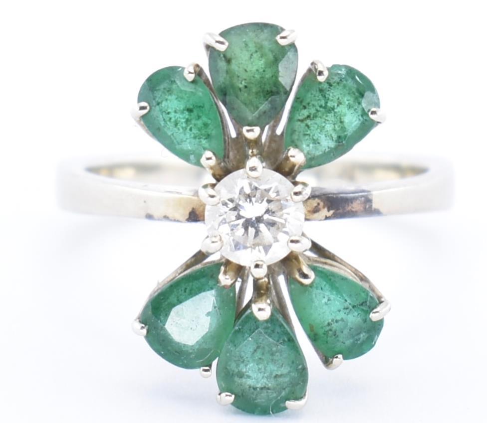 AN 18CT GOLD EMERALD AND DIAMOND CLUSTER RING