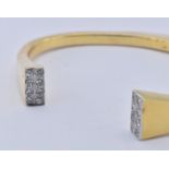 18CT GOLD AND DIAMOND BANGLE BRACELET