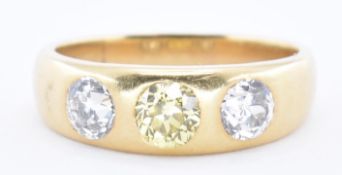 AN 18CT GOLD THREE STONE DIAMOND RING