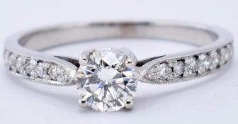 18CT WHITE GOLD AND DIAMOND SOLITAIRE RING