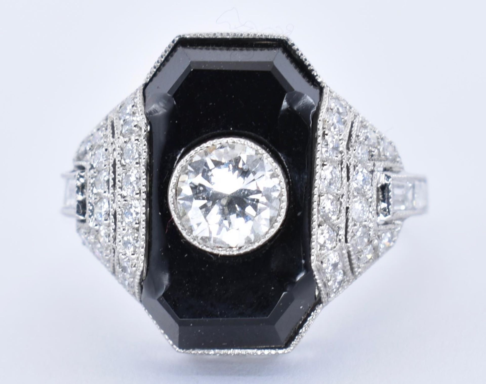 PLATINUM, ONYX AND DIAMOND ART DECO DRESS RING