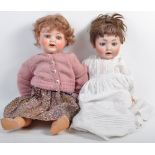 TWO ANTIQUE GERMAN MADE BISQUE HEADED DOLLS