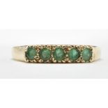 9CT GOLD AND FIVE GREEN STONE RING