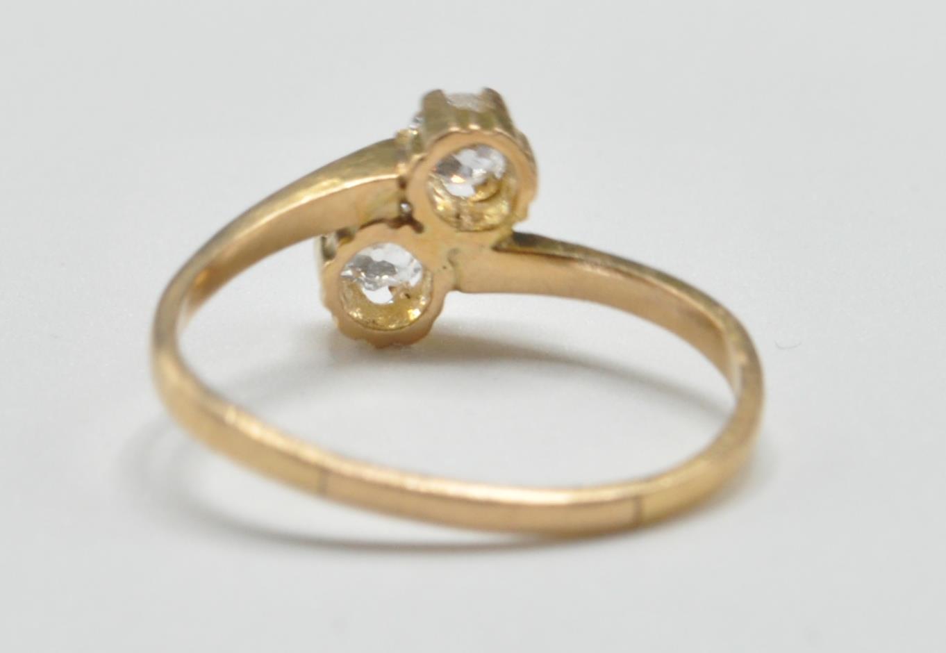 GOLD AND DIAMOND TWO STONE CORSSOVER RING - Image 3 of 5