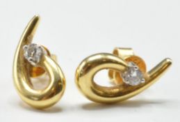 PAIR OF 18CT GOLD AND DIAMOND STUD EARRINGS