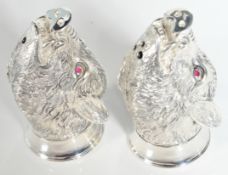 PAIR OF SILVER PLATED SALT AND PEPPER SHAKERS IN THE FORM OF BOARS HEADS.