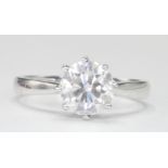 18CT WHITE GOLD AND DIAMOND SOLITAIRE RING