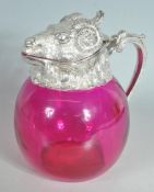 J D & S SILVER PLATED RAMS HEAD DECANTER WITH CRANBERRY GLASS