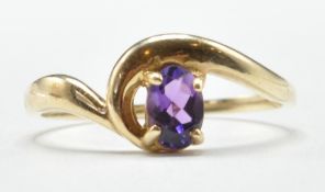 9CT GOLD AND PURPLE STONE RING