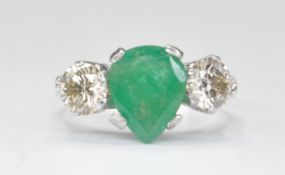 18CT WHITE GOLD EMERALD AND DIAMOND THREE STONE RING