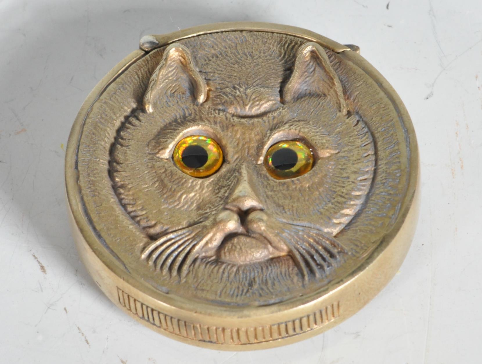 VINTAGE STYLE BRASS VESTA CASE IN THE MANNER OF LOUIS WAIN.