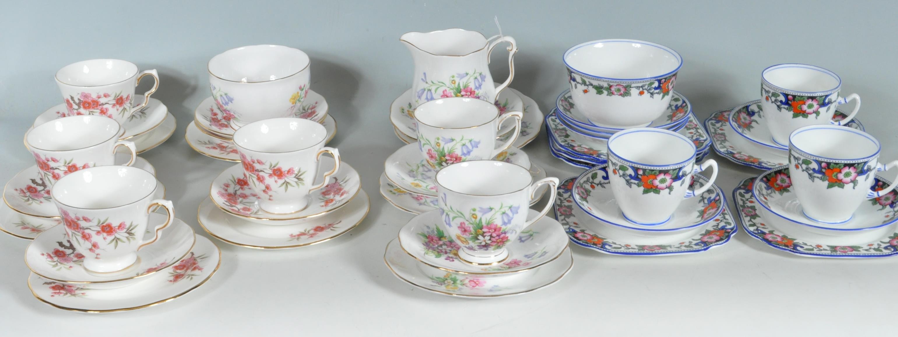 A COLLECTION OF THREE PART TEA SETS