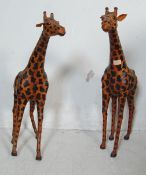 TWO LARGE LEATHER COVERED GIRAFFES