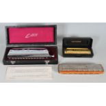 THREE VINTAGE HARMONICA MUSICAL INSTRUMENTS