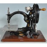 19TH CENTURY VICTORIAN WILCOX AND GIBBS HAND OPERATED CAST IRON SEWING MACHINE