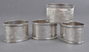 SET OF FOUR JOHN ROSE SILVER NUMBERED NAPKIN RINGS