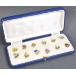 CASED SET OF 1920S STERLING SILVER & ENAMEL CUP TOKENS