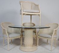 DANISH INSPIRED GLASS TOP DINING TABLE AND FOUR CANE CHAIRS