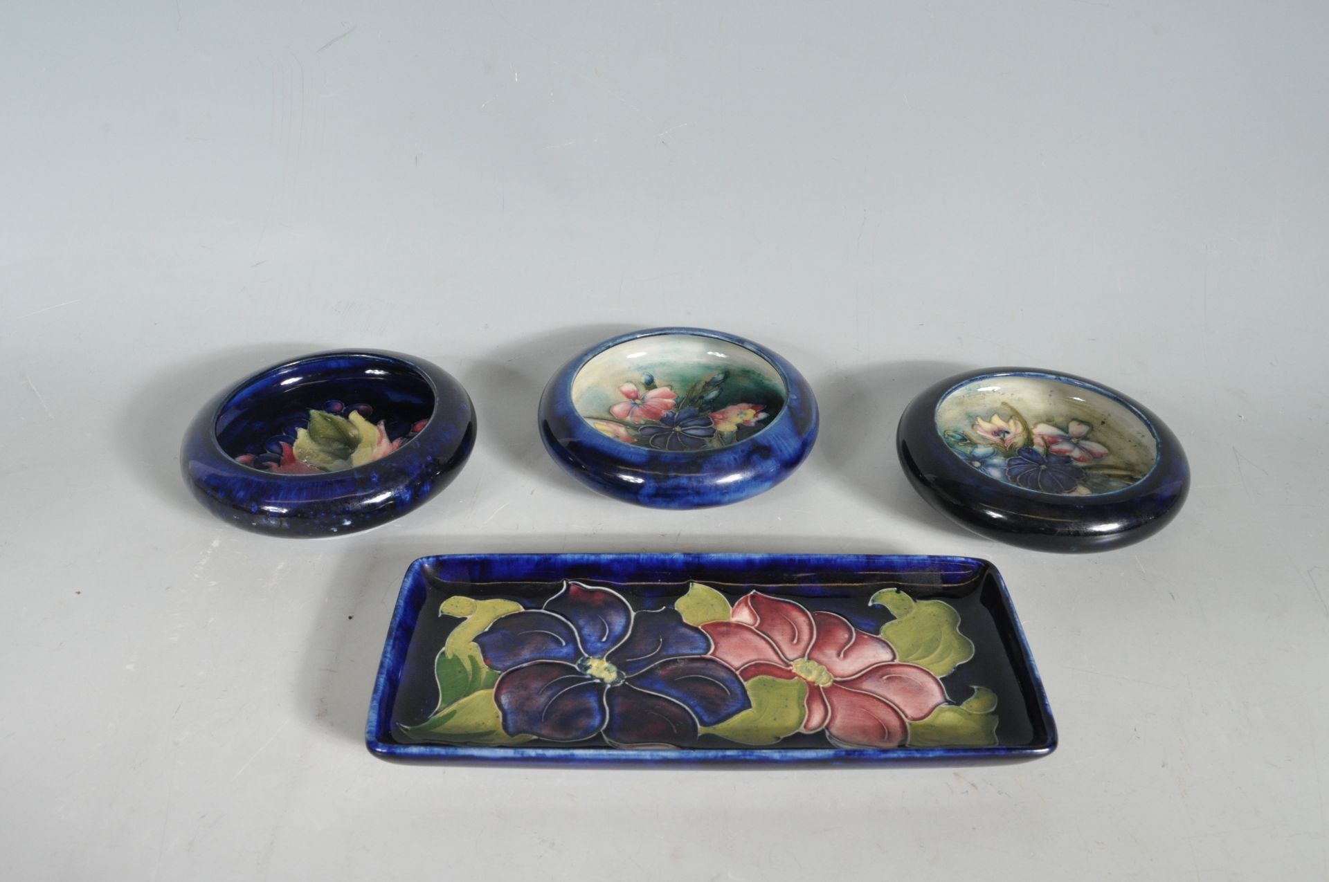 COLLECTION OF FOUR MOORCROFT DISHES