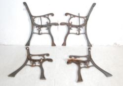 TWO PAIRS OF VICTORIAN INFLUNCE CAST IRON BENCH ENDS