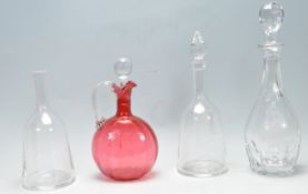 COLLECTION OF FOUR 19TH CENTURY AND LATER CUT GLASS DECANTERS