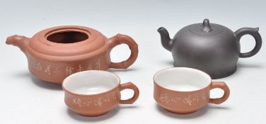 FOUR PIECES OF CHINESE YI XING CLAY POTTERY