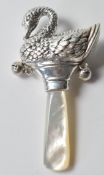 STAMPED STERLING SILVER BABIES RATTLE IN THE FORM OF A SWAN.