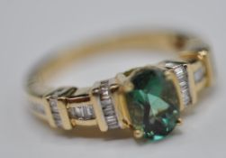 9CT GOLD LADIES DRESS RING WITH LARGE FACETED TOURMALINE STONE