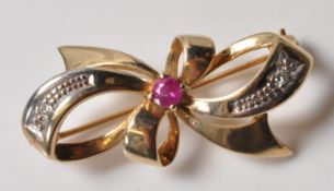 9CT GOLD PINK STONE AND DIAMOND BROOCH