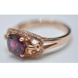 10CT ROSEGOLD LADIES RING WITH CENTRAL FACETED GARNET